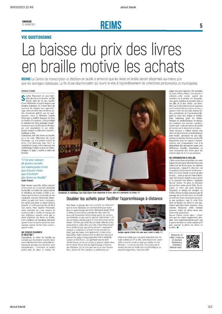 article de journal
on voit aurore tenir un livre en braille